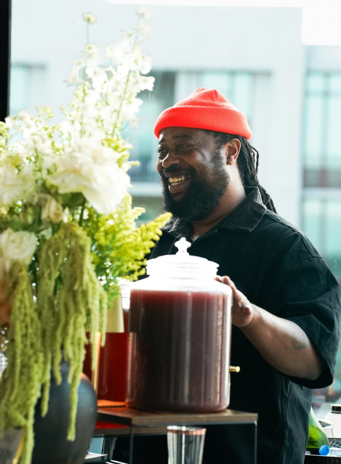 Pouring drinks with a grin