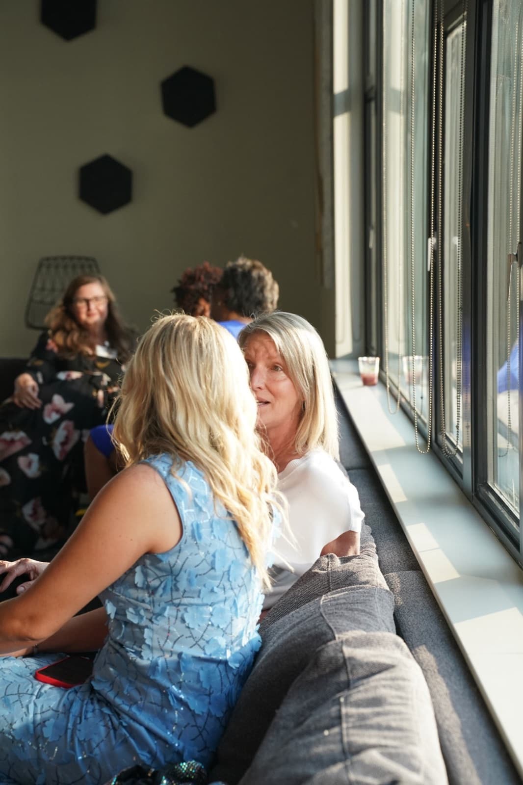 Guests talking by the window